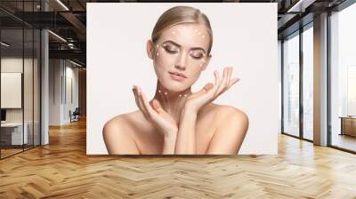 close-up portrait of young, beautiful and healthy woman with arrows on her face. the spa, surgery, f Wall mural