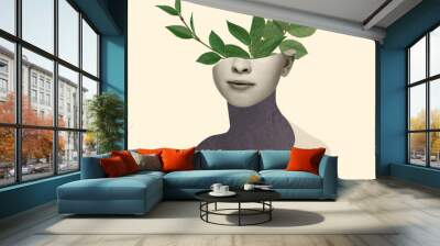 Contemporary art collage, modern design. Retro style. Beautiful female face with green leaves of plant on pastel yellow background. Wall mural