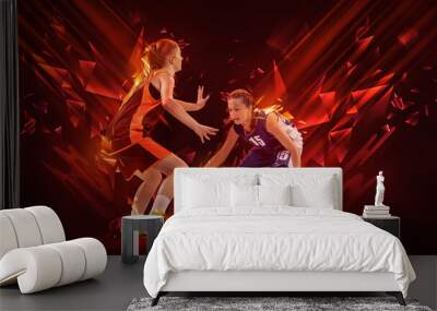 Creative artwork with two young female basketball players playing basketball isolated on dark background with neon elements. Concept of sport, enegry Wall mural