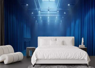 Creative image of empty indoor tennis court with curtains of light blue fabric. Wall mural