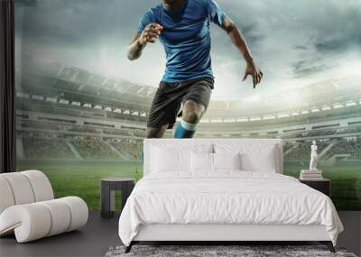 Cropped image of running soccer, football player at stadium during football match. Concept of sport, competition, goals Wall mural