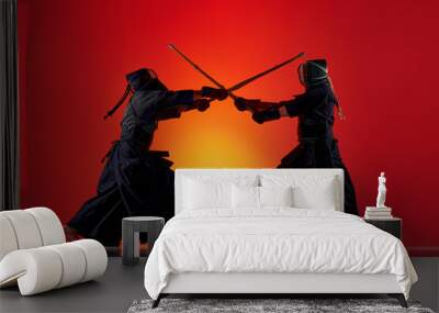 Dynamic image of two men, professional kendo athletes training with bamboo shinai sword against gradient red studio background in neon light. Concept of martial arts, sport, Japanese culture, motion Wall mural