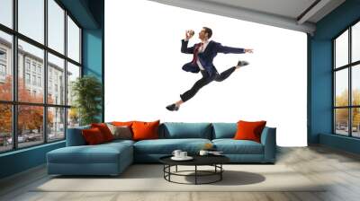 Energetic businessman in mid-leap pose jumping to work, drinking coffee on his way isolated on white background. Employee showing excitement. Concept of business, office lifestyle, motivation Wall mural