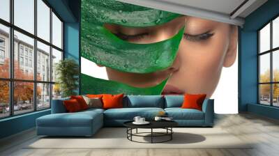 Eyelids. Close up portrait of beautiful young woman with monstera leaf. Concept of cosmetics, makeup, natural and eco treatment, skin care. Shiny and healthy look, fashion, healthcare. Details. Wall mural