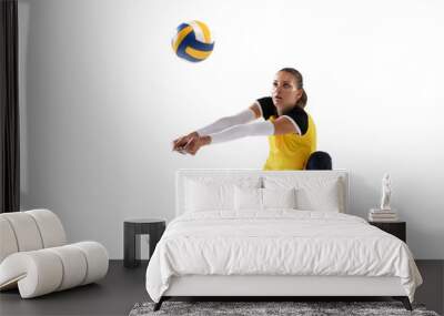 Female professional volleyball player with ball isolated on white studio background. The athlete, exercise, action, sport, healthy lifestyle, training, fitness concept. Wall mural