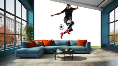 Female soccer player kicking ball isolated over white background Wall mural