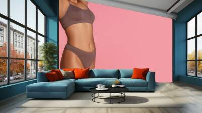 Flyer with copyspace. Beautiful body of young african-american woman isolated on pink studio background. Fit, healthy and strong body. Natural beauty, treatment, healthcare, fitness and diet concept. Wall mural