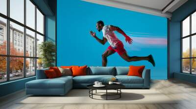 Full length portrait of active young muscular running man, Wall mural