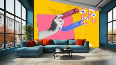 Hand with magnet attracting social media icons from laptop screen. Contemporary art. Visual for influencer marketing platforms to attract content creators. Digital marketing, online services concept Wall mural