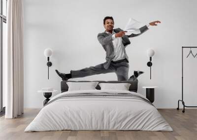 happy businessman dancing in motion isolated on white studio background. flexibility and grace in bu Wall mural