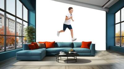 Happy kids, little and emotional caucasian boy jumping and running isolated on white background. Look happy, cheerful, sincere. Copyspace for ad. Childhood, education, happiness concept. Wall mural