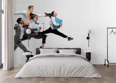 happy office workers jumping and dancing in casual clothes or suit with folders on white. ballet dan Wall mural