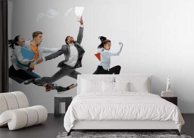 Happy office workers jumping and dancing in casual clothes or suit with folders on white. Ballet dancers. Business, start-up, working open-space, motion and action concept. Creative collage. Copyspace Wall mural