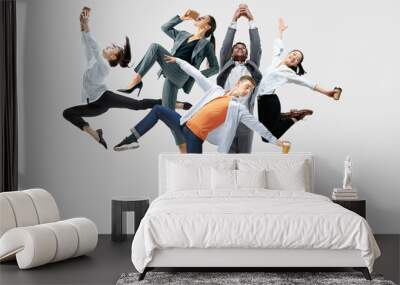 Happy office workers jumping and dancing in casual clothes or suit with folders on white. Ballet dancers. Business, start-up, working open-space, motion and action concept. Creative collage. Wall mural