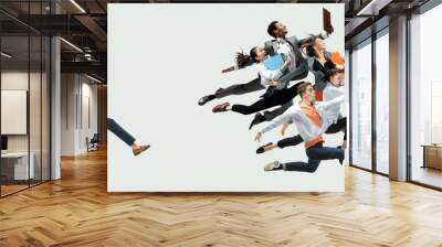 Happy office workers jumping and dancing in casual clothes or suit with folders on white. Ballet dancers. Business, start-up, working open-space, motion and action concept. Creative collage. Wall mural