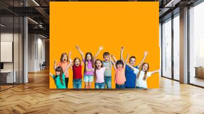 Happy success teensl celebrating being a winner. Dynamic energetic image of happy children Wall mural