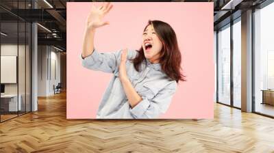 I'm afraid. Fright. Portrait of the scared woman. Business woman standing isolated on trendy pink studio background. Female half-length portrait. Human emotions, facial expression concept. Front view Wall mural