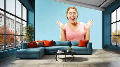 I won. Winning success happy woman celebrating being a winner. Dynamic image of caucasian female model on blue studio background. Victory, delight concept. Human facial emotions concept. Trendy colors Wall mural