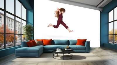 Jumping, flying. Happy, smiley little caucasian girl isolated on white studio background with copyspace for ad. Looks happy, cheerful. Childhood, education, human emotions, facial expression concept. Wall mural