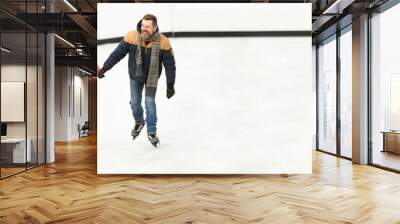 Middle-aged people, couple, man and woman in winter clothes skating on open air ice rink. Outdoor activity. Banner. Concept of leisure time, winter hobby, sport, vacation, fun, relationship, emotions. Wall mural