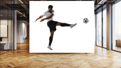 One African man football player training isolated on white background. Concept of sport, movement, energy and dynamic. Wall mural