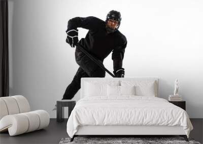 Portrait of professional male hockey player training isolated over white background. Match, competition preparation. Wall mural