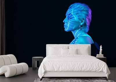 Portrait of young blonde girl with digital holographic neon stripes on face posing over dark background in blue neon lights. Concept of art, modern style, cyberpunk, futurism and creativity Wall mural