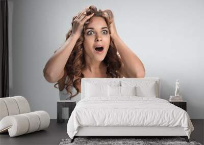 portrait of young woman with shocked facial expression Wall mural