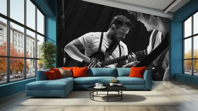 Repetition of rock music band at music studio. Cropped image of electric and acoustic guitar players at concert. Rehearsal base Concept of art, music, style Wall mural