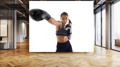 Serious, concentrated young woman growing skills in boxing punches, training isolated on white studio background. Self-defense. Concept of sport, hobby, active and healthy lifestyle Wall mural