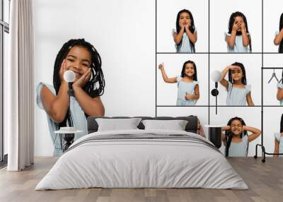 Set of images of little cute kid, beautiful african girl isolated on white studio background. Education, emotions, facial expression and childhood concept. Wall mural