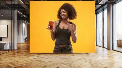 Sexy young afro woman drinking beer, not isolated on white background Wall mural