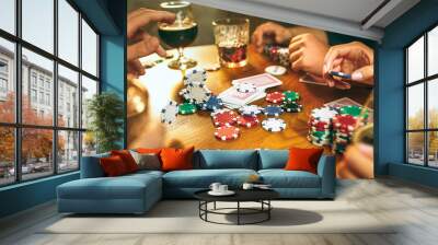 Side view photo of friends sitting at wooden table. Friends having fun while playing board game. Wall mural