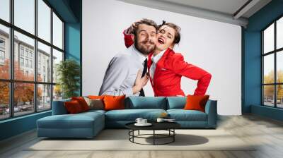 The business man and woman embracing on a gray background Wall mural