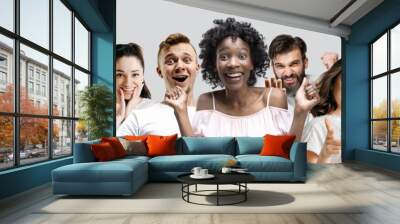 The collage of faces of surprised people on white studio backgrounds. Human emotions, facial expression concept. Collage of astonished men and women. Wall mural