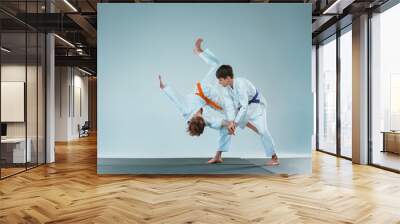 The two boys fighting at Aikido training in martial arts school. Healthy lifestyle and sports concept Wall mural