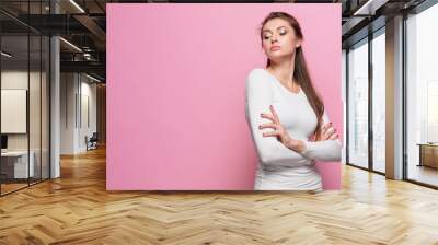 The young woman's portrait with proud and arrogant emotions Wall mural