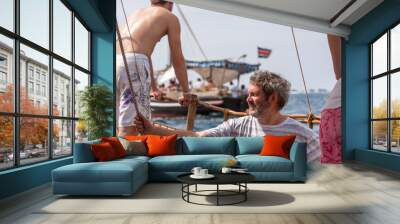 tourists enjoying sea on yacht. ship traveling in kenya Wall mural