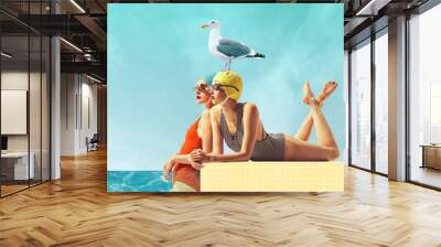 Two beautiful women in vintage swimsuits cap and sunglasses enjoying sea view with seagull. Contemporary art collage. Concept of summer, vacation, relaxation, fashion. Retro style. Creative design. Wall mural