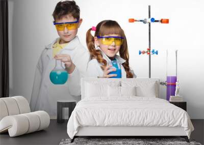 two cute children at chemistry lesson making experiments Wall mural