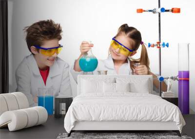 two cute children at chemistry lesson making experiments Wall mural