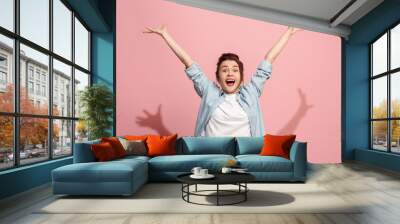 Winning success woman happy ecstatic celebrating being a winner. Dynamic energetic image of female model Wall mural