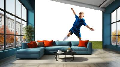 Young boy as a soccer or football player in sportwear making a feint or a kick with the ball for a goal on white studio background. Fit playing boy in action, movement, motion at game. Wall mural