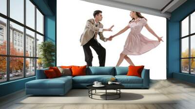 Young man and woman in vintage retro style outfits dancing social dance isolated on white background. Timeless traditions, 1960s american fashion style and art Wall mural