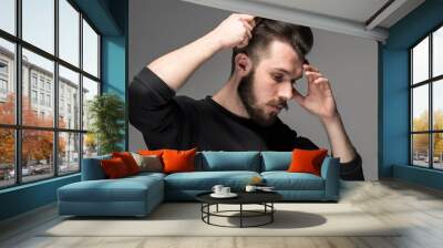 young man comb his hair Wall mural