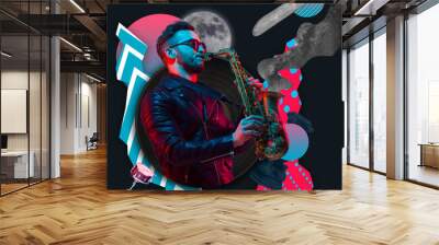 Young man playing saxophone isolated over black red blue abstract background. Contemporary art collage. Inspiration, idea, trendy urban magazine style. Wall mural