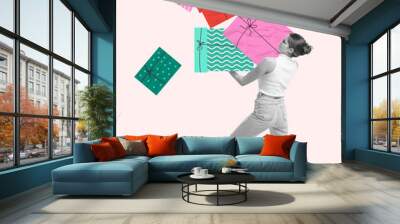 Young woman holding many colorful wrapped present boxes against light background. Shopping for gifts. Contemporary art collage. Concept of Christmas and New Year, winter holidays. Postcard template Wall mural