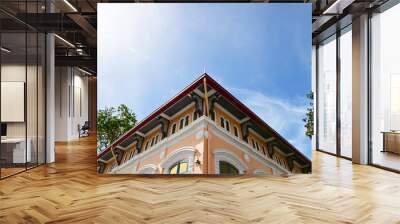 Part of the Roof of a temple in Thailand. Traditional Thai style pattern on the roof of a temple with Blue Sky Background. Wall mural