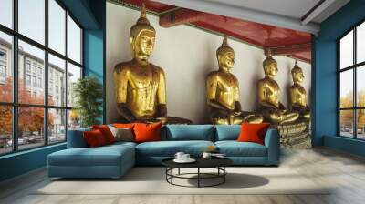 Golden buddha statues in Wat Po monastery in Bangkok Thailand Wall mural