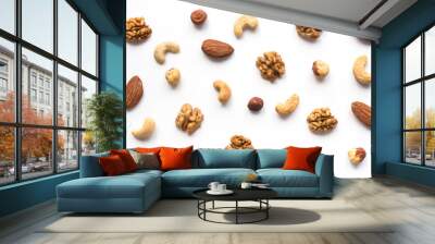 Isolated nuts pattern backdrop. Walnut, cashew, almond and hazelnut on white background. Top view.  Wall mural